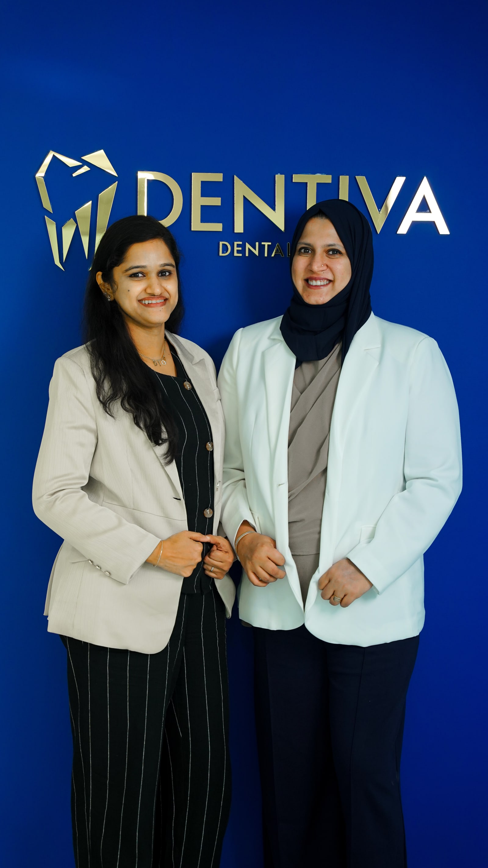 Dr. Rubymol Ranjith and Dr. Habeeba Banu standing together at Dentiva Dental Clinic